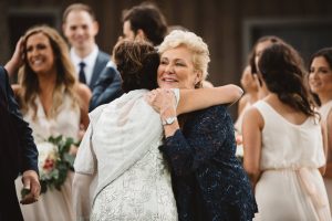Mothers Hugging at Wedding - Olive Photography